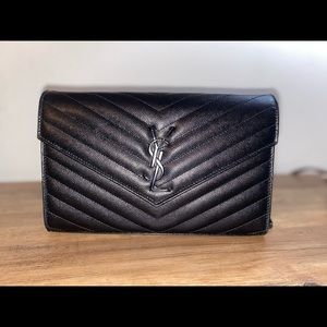 Black YSL like new. I used it twice. Comes with original box.